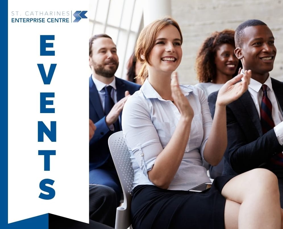 A group of business professionals sitting at an event